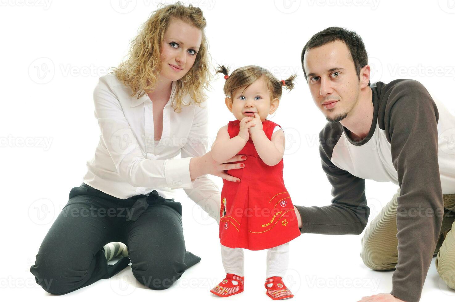 happy young family together in studio photo