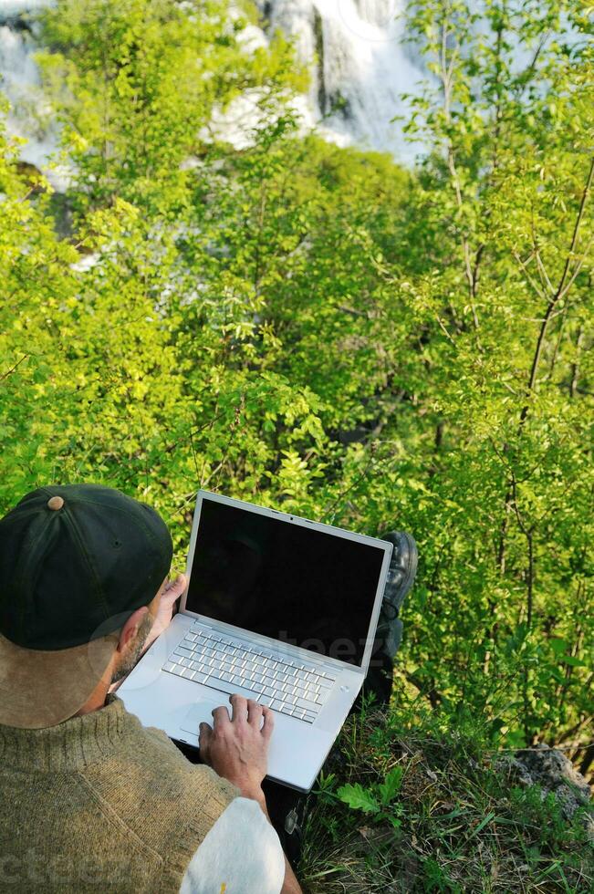 man outdoor laptop photo