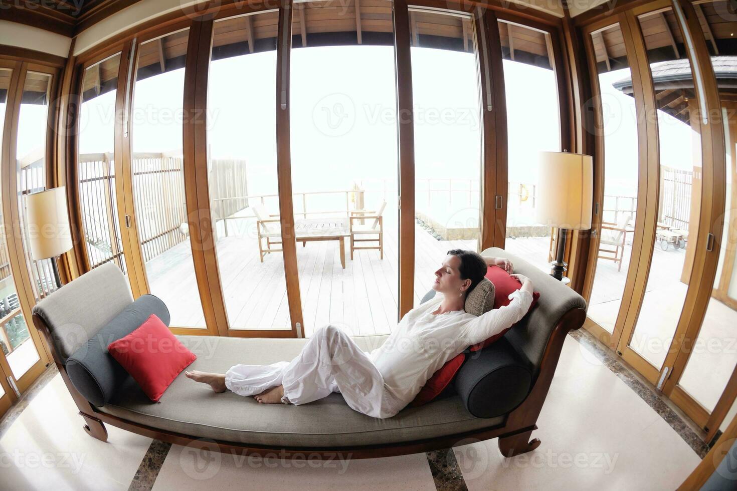 happy young woman relax at home on sofa photo