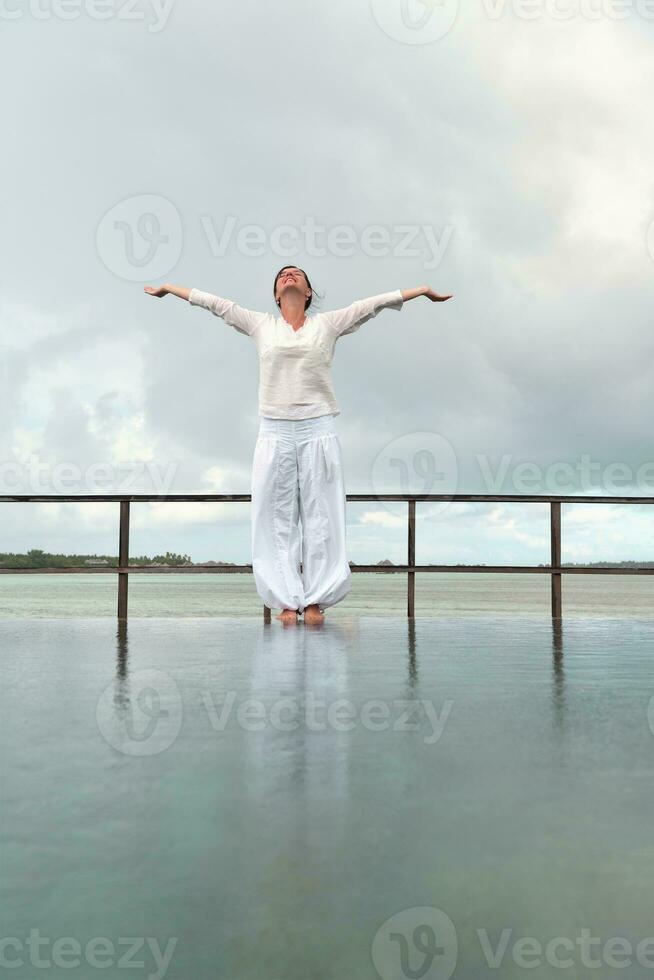 young woman relax on cloudy summer day photo