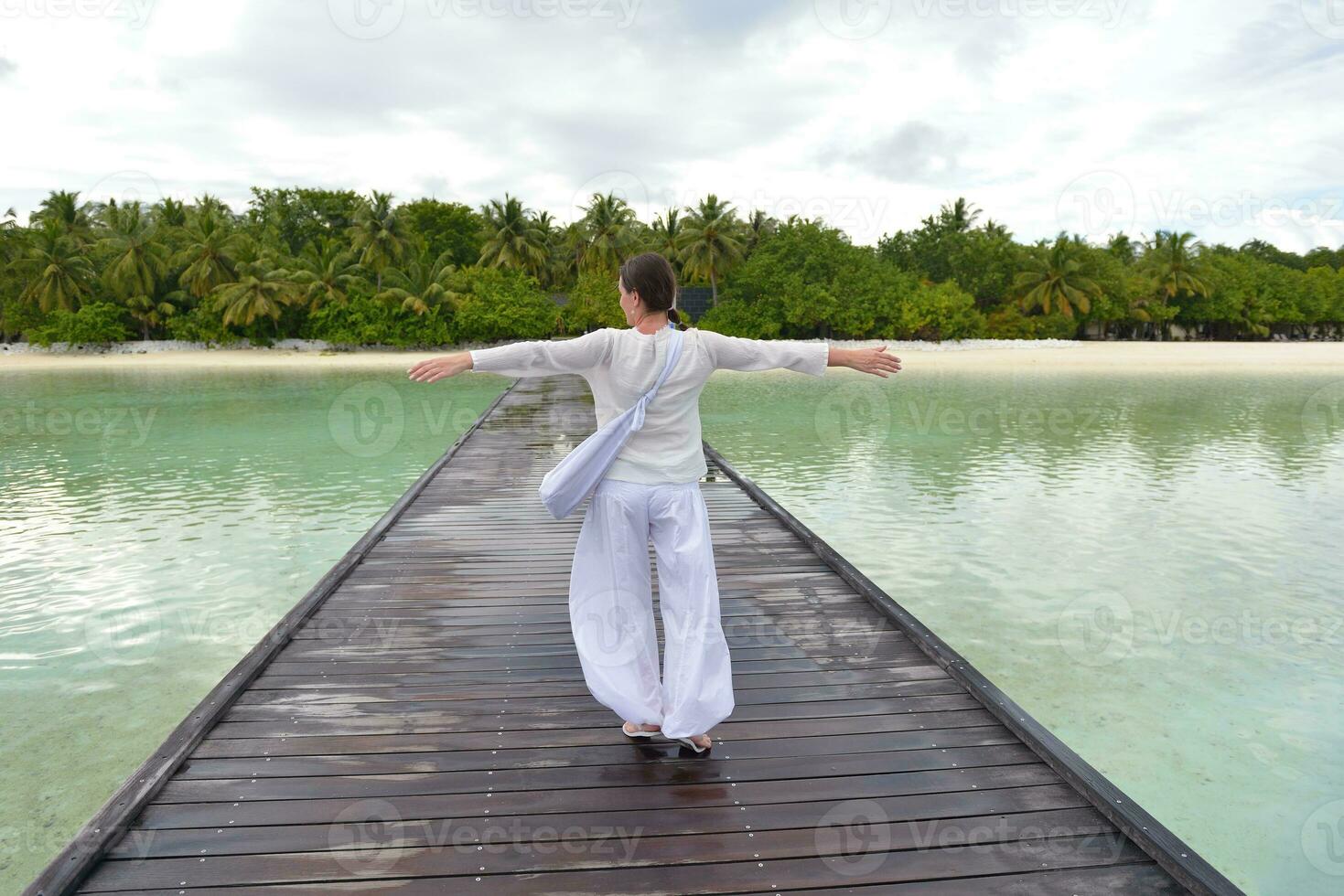 young woman relax on cloudy summer day photo