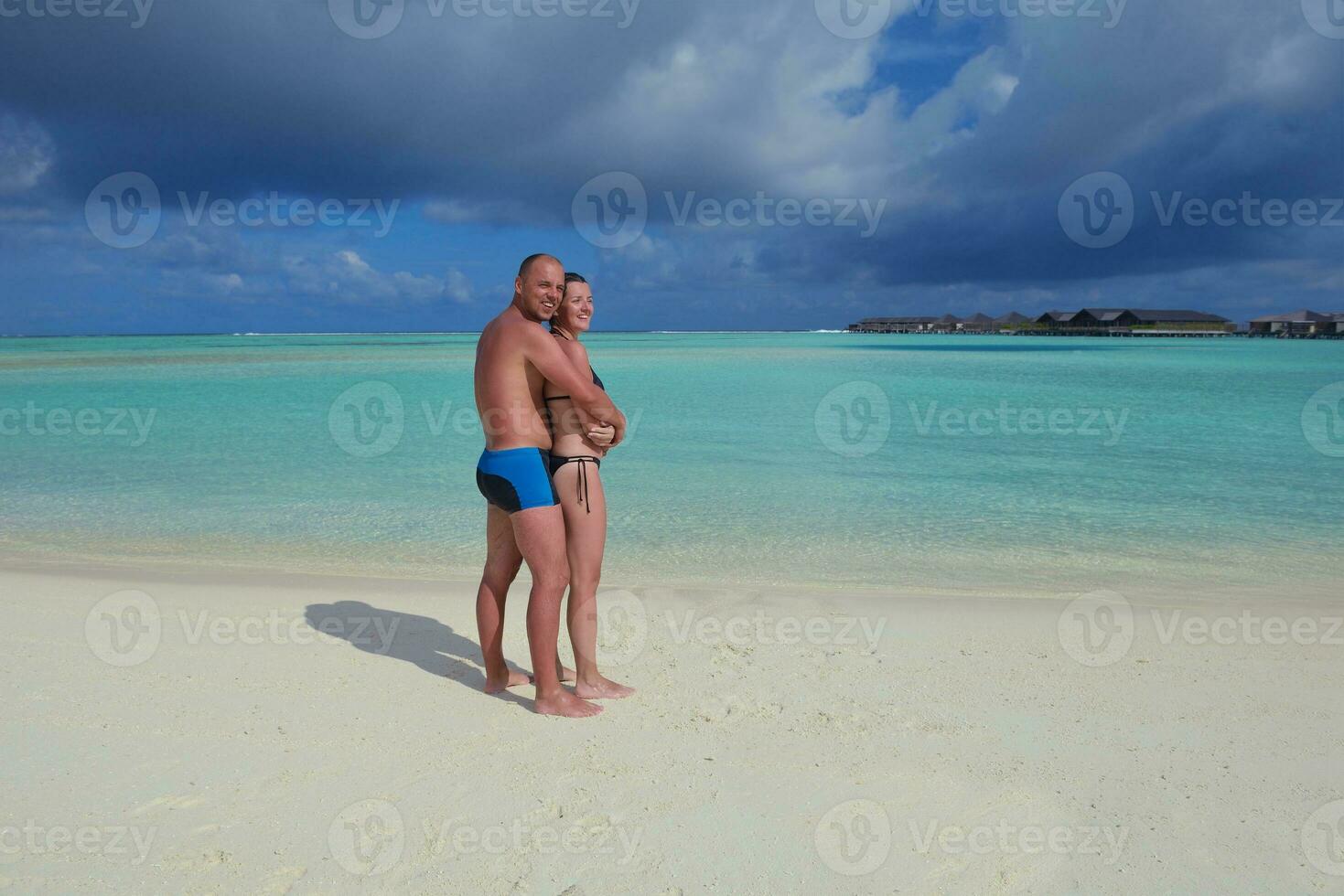 happy young  couple at summer vacation have fun and relax at beach photo