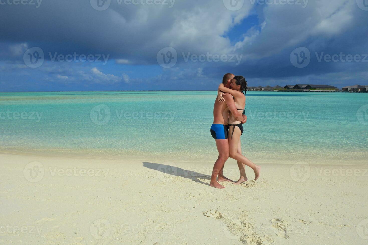 happy young  couple at summer vacation have fun and relax at beach photo