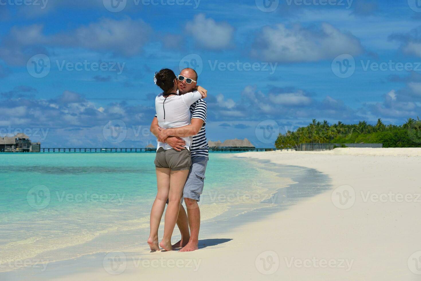 happy young  couple at summer vacation have fun and relax at beach photo