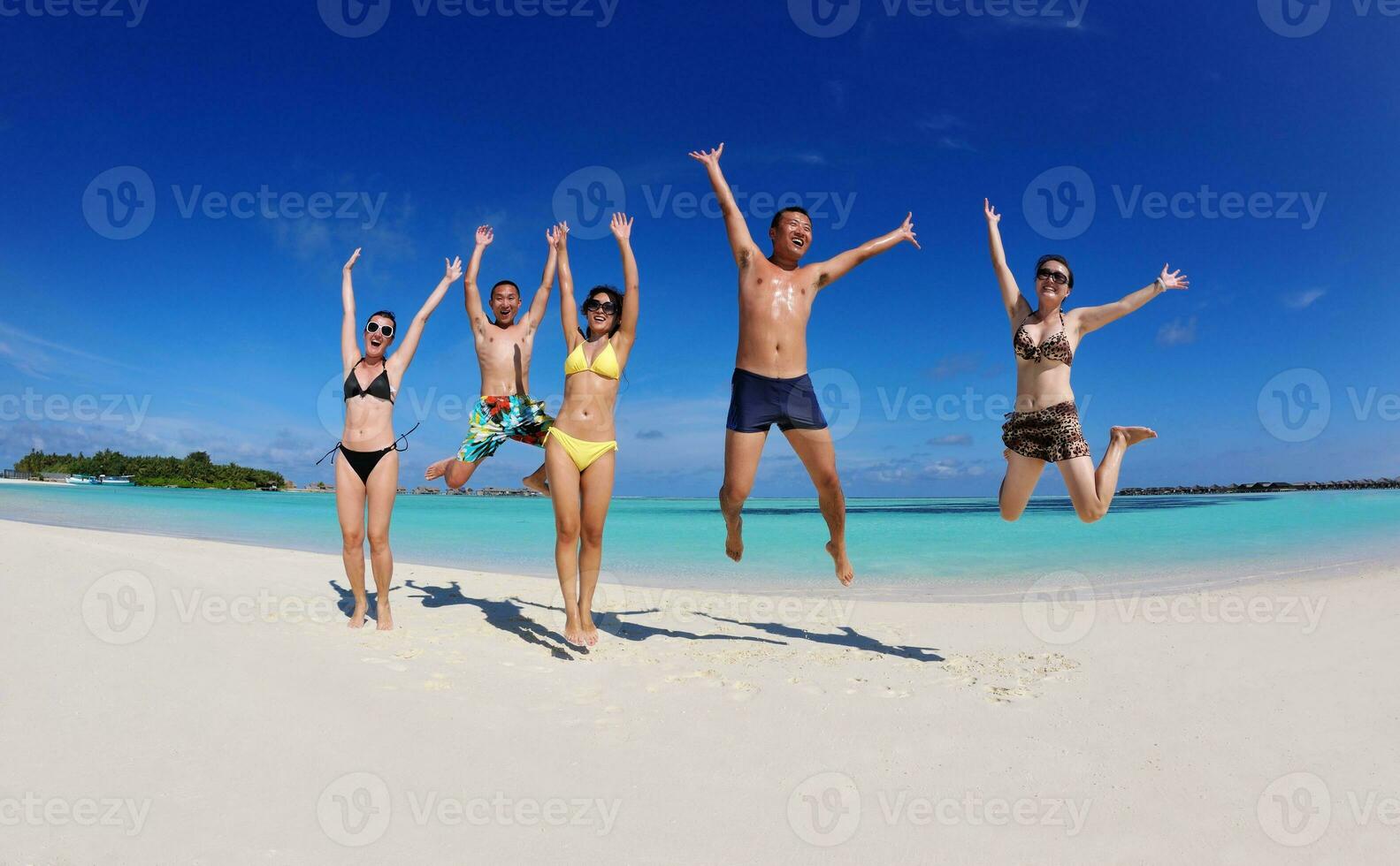 group of happy young people have fun on bach photo