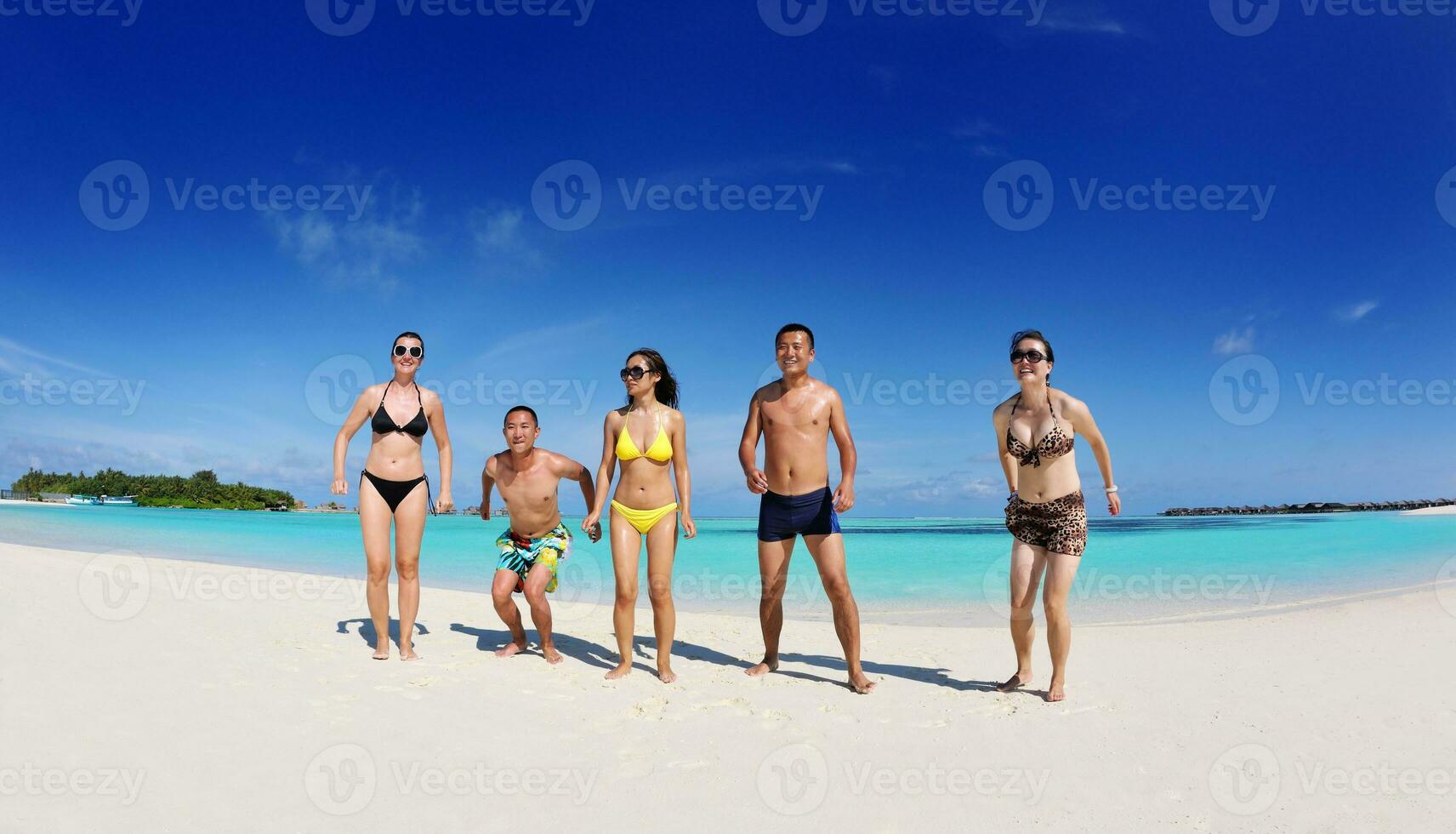 group of happy young people have fun on bach photo