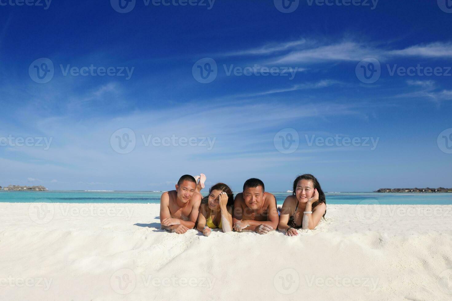 group of happy young people have fun on bach photo