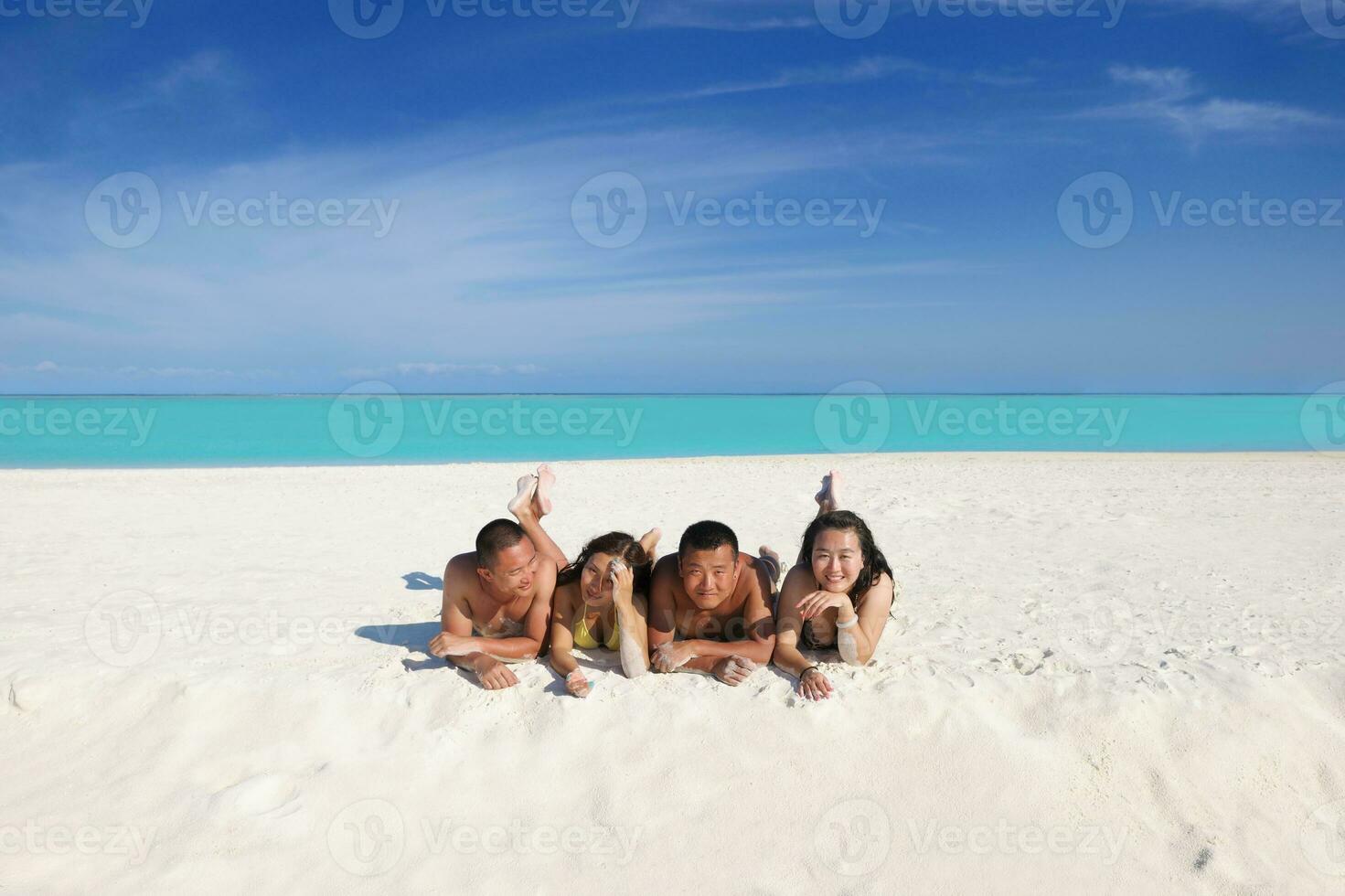 group of happy young people have fun on bach photo