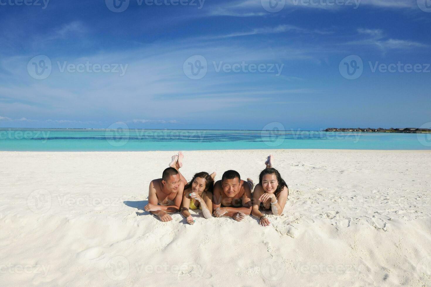 group of happy young people have fun on bach photo