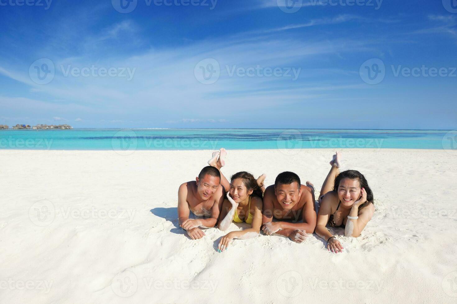 group of happy young people have fun on bach photo