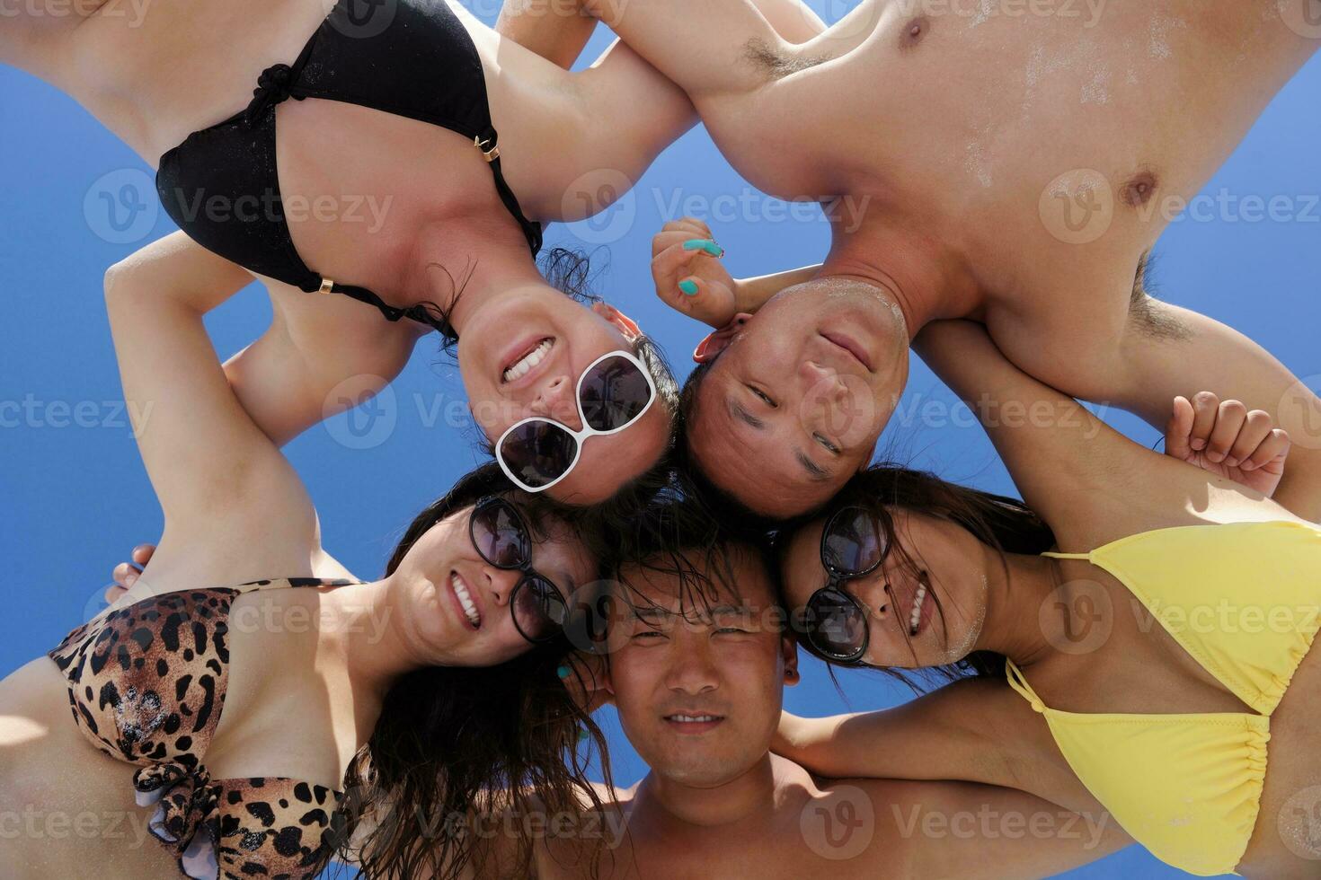group of happy young people have fun on bach photo