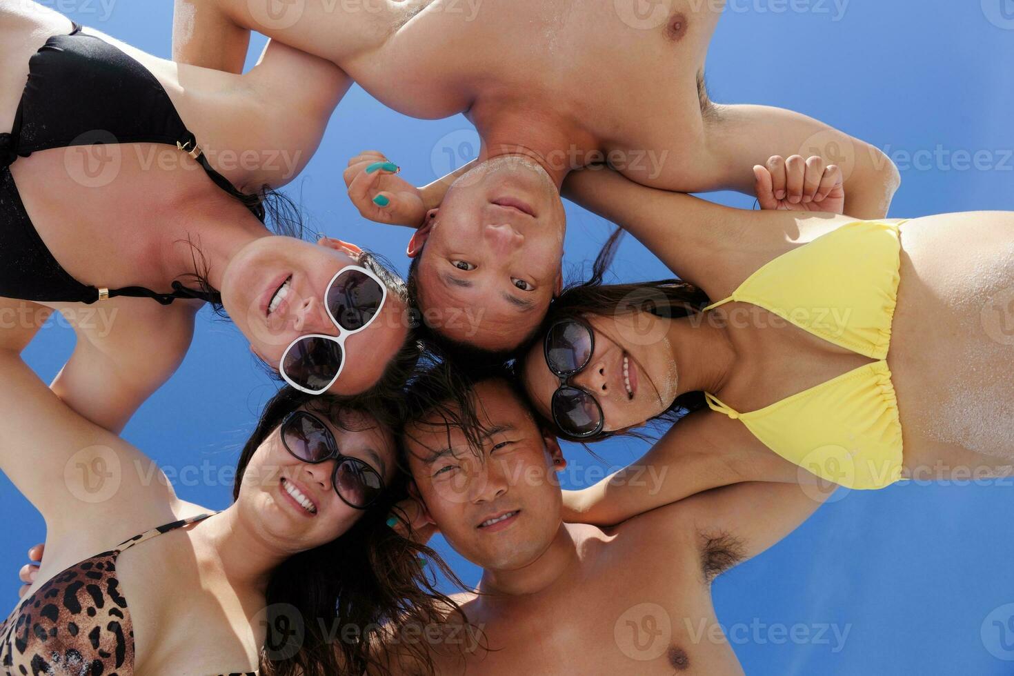 group of happy young people have fun on bach photo