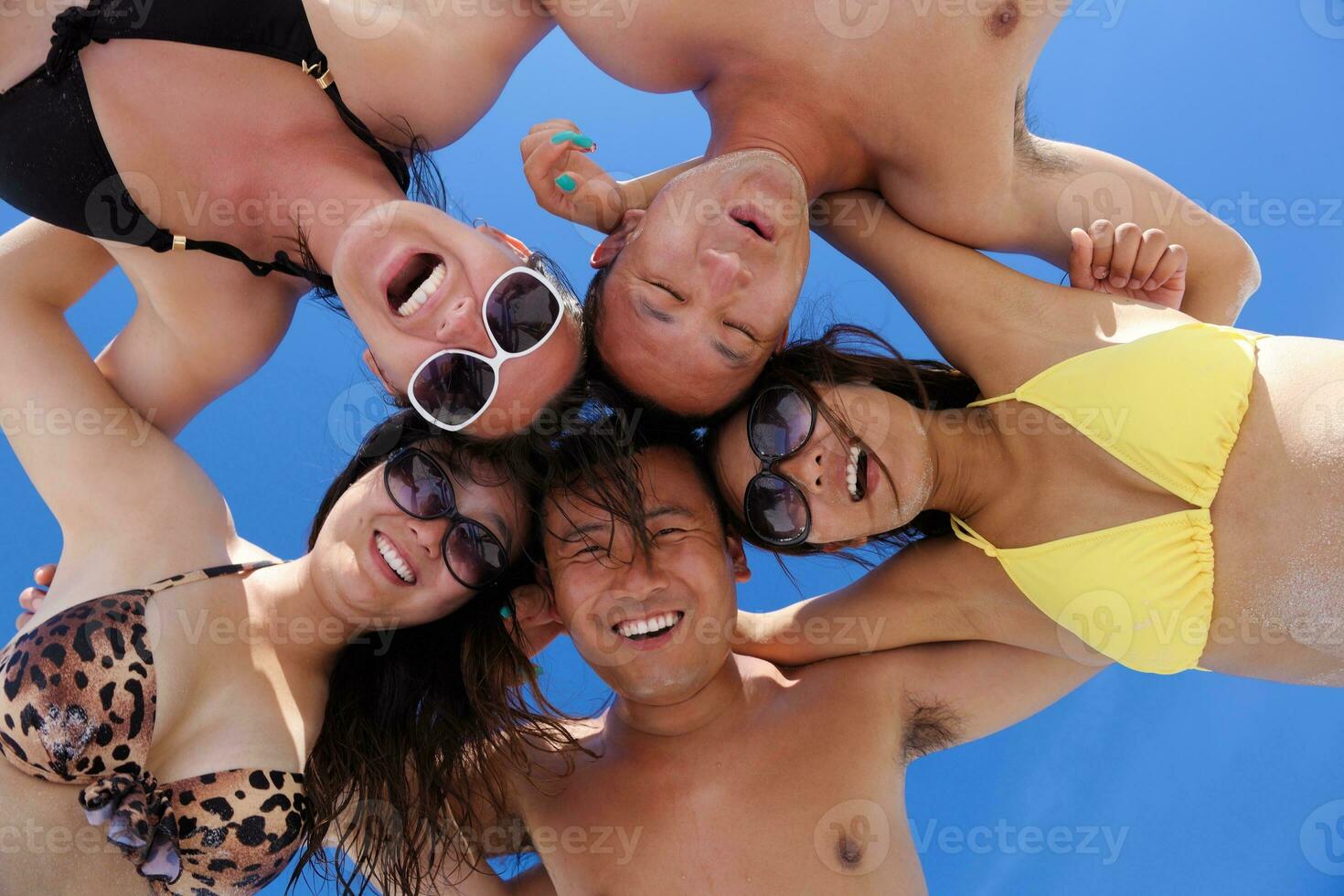group of happy young people have fun on bach photo
