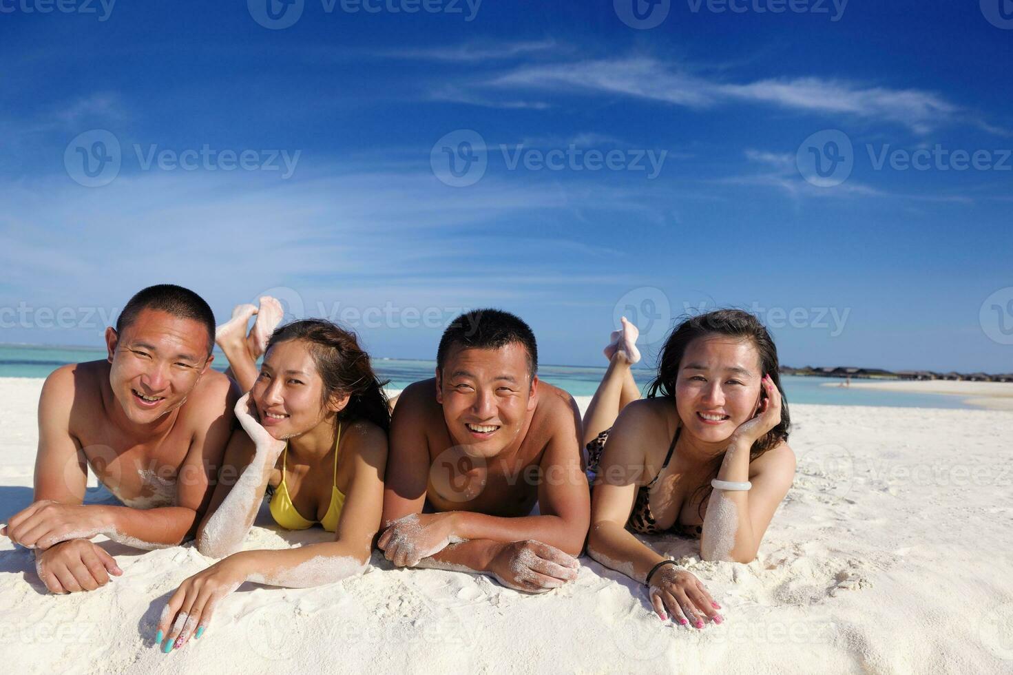group of happy young people have fun on bach photo