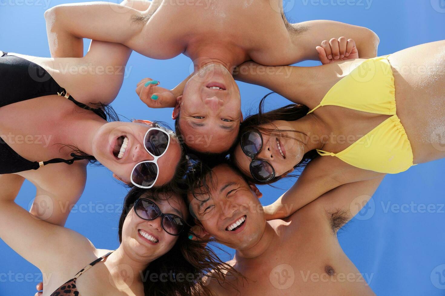 group of happy young people have fun on bach photo