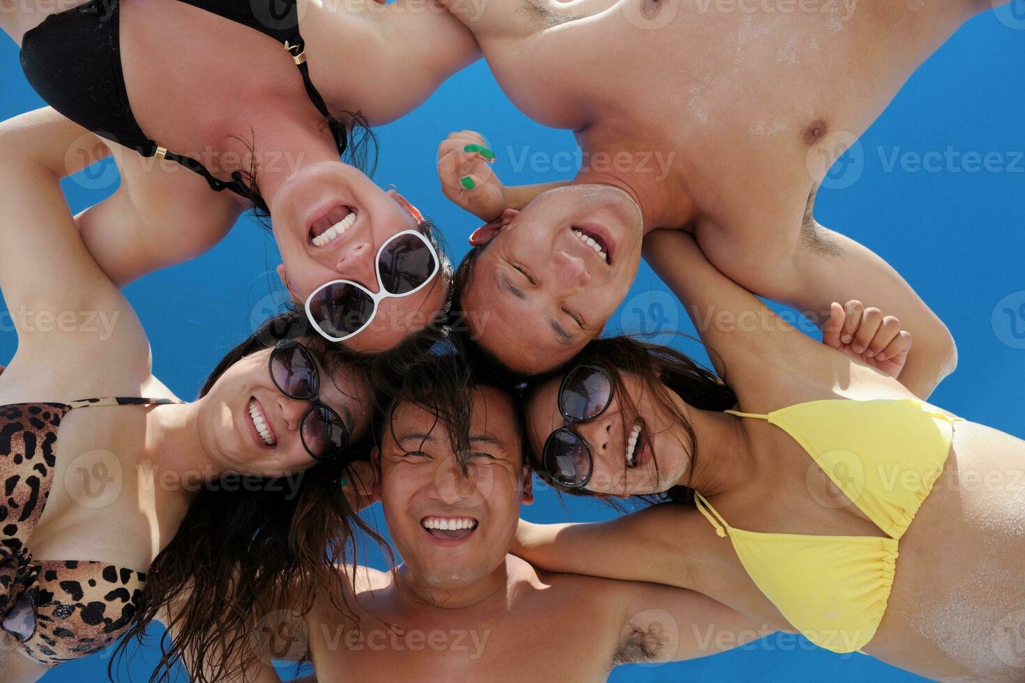 group of happy young people have fun on bach photo