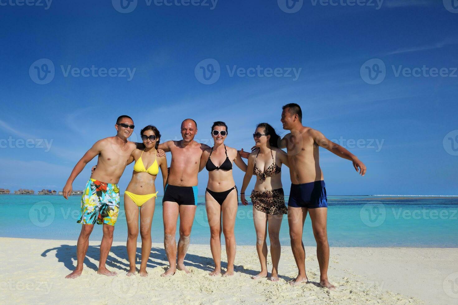 group of happy young people have fun on bach photo