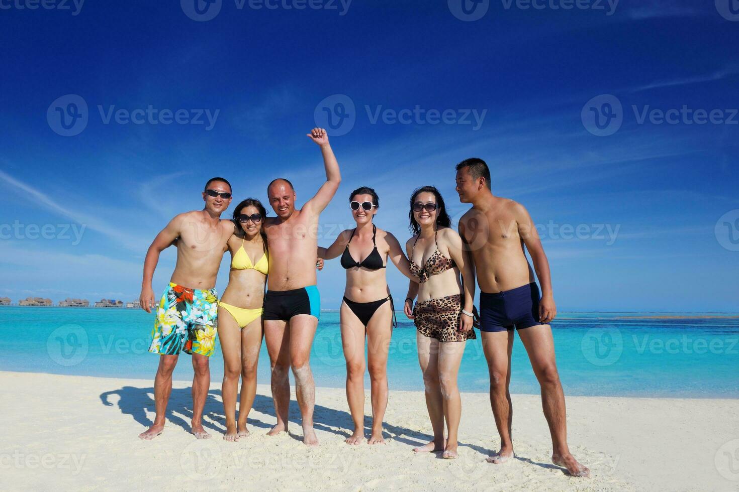 group of happy young people have fun on bach photo