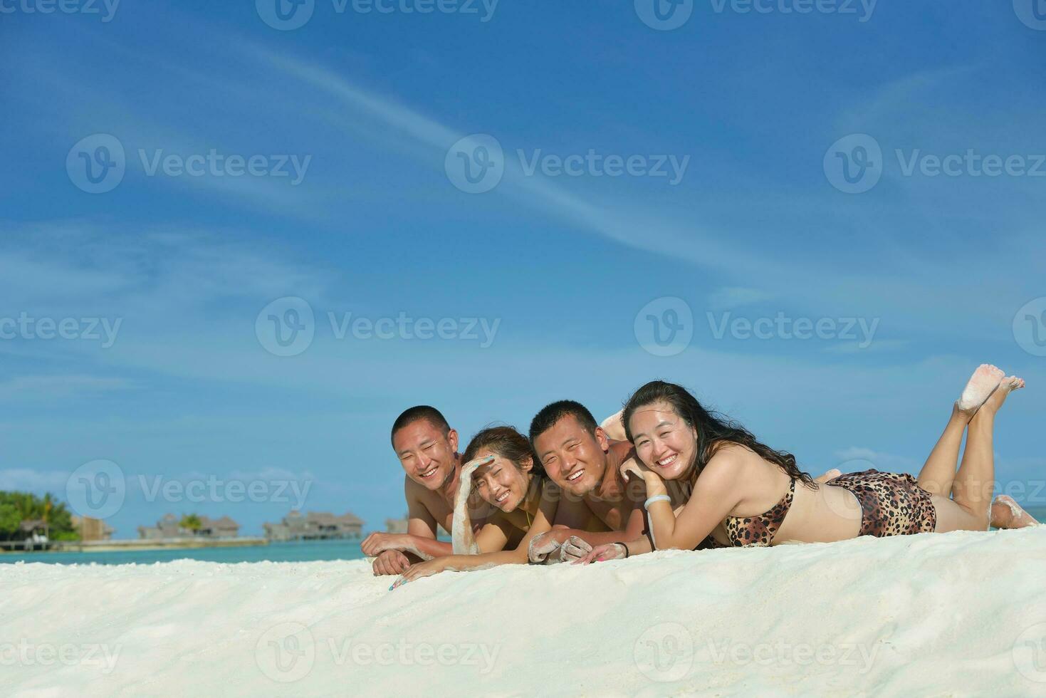 group of happy young people have fun on bach photo