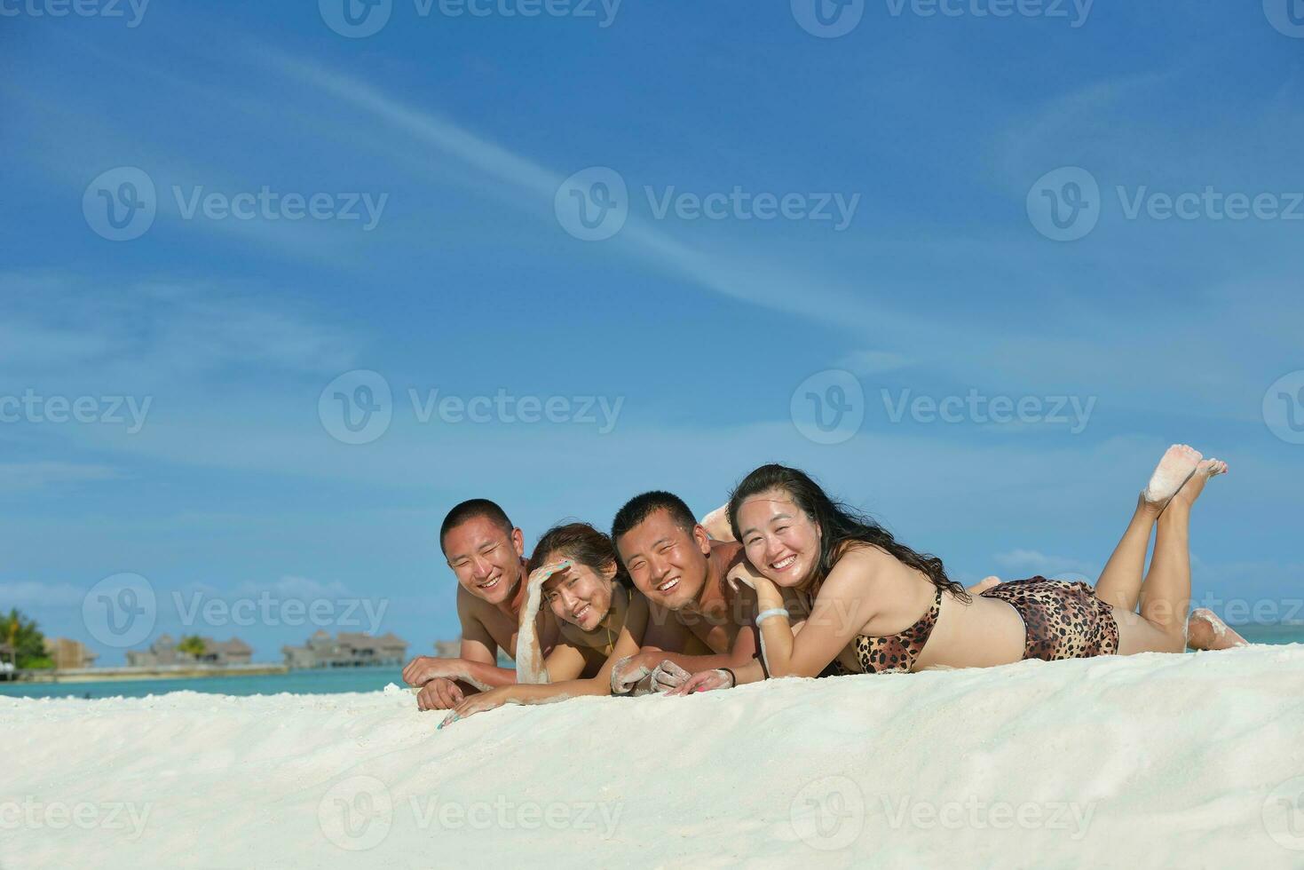 group of happy young people have fun on bach photo