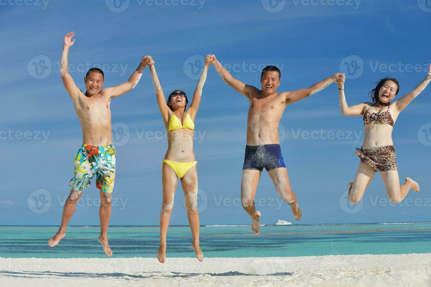 group of happy young people have fun on bach photo