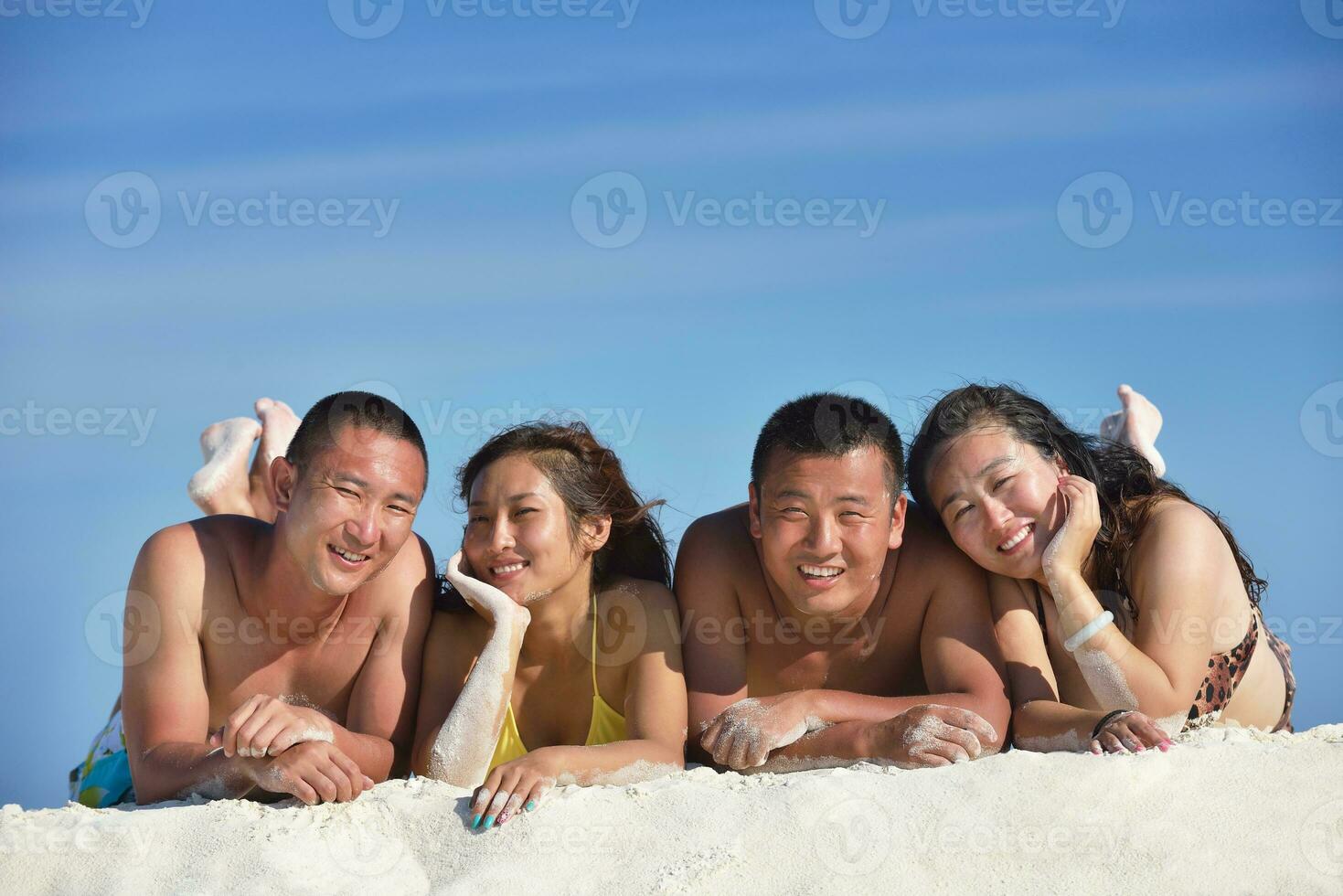 group of happy young people have fun on bach photo