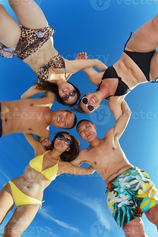 group of happy young people have fun on bach photo