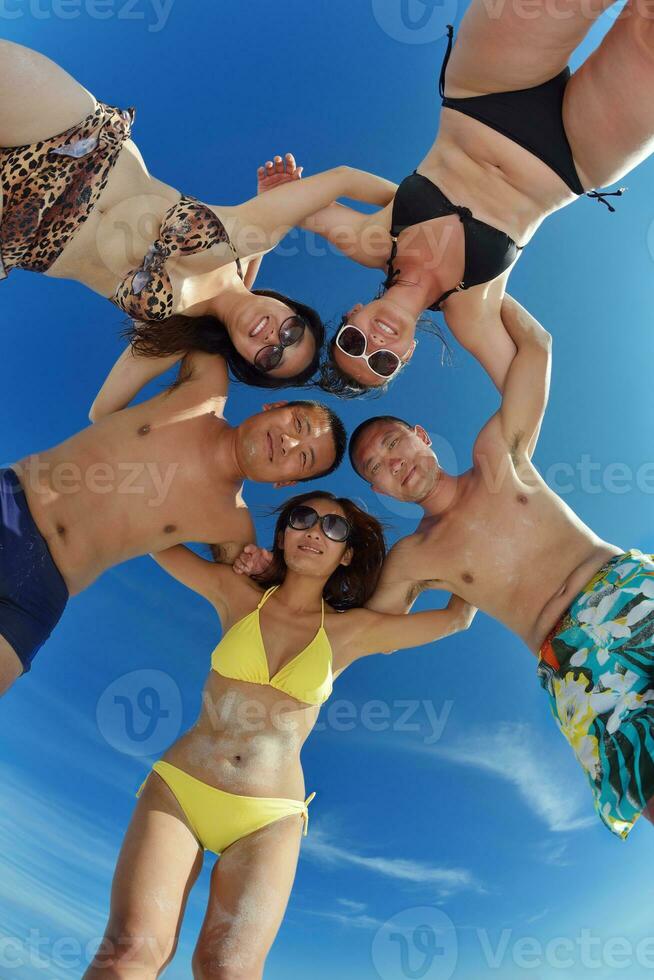 group of happy young people have fun on bach photo