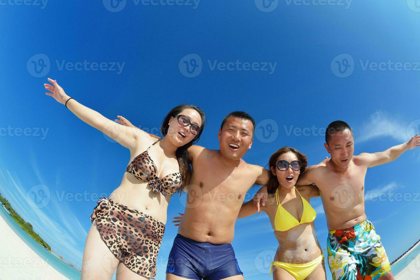 group of happy young people have fun on bach photo