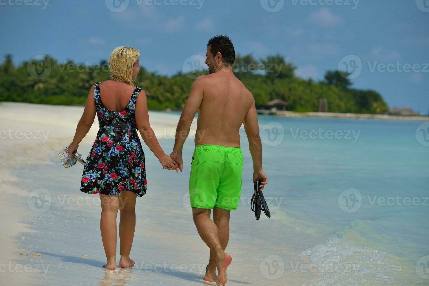 happy young  couple at summer vacation have fun and relax at beach photo