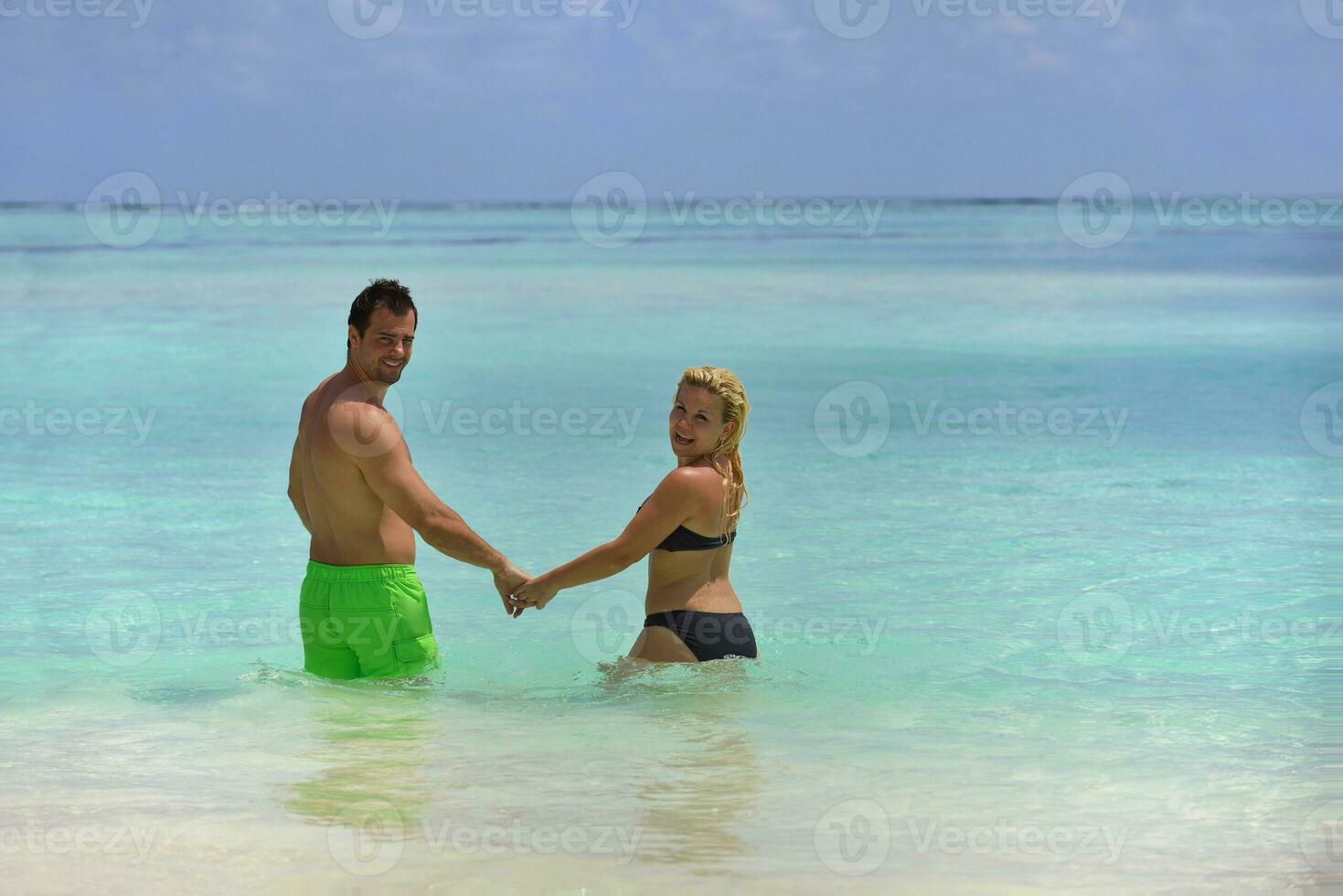 happy young  couple at summer vacation have fun and relax at beach photo