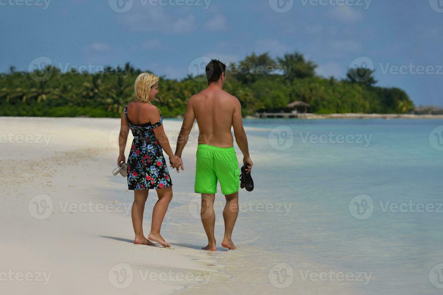 happy young  couple at summer vacation have fun and relax at beach photo