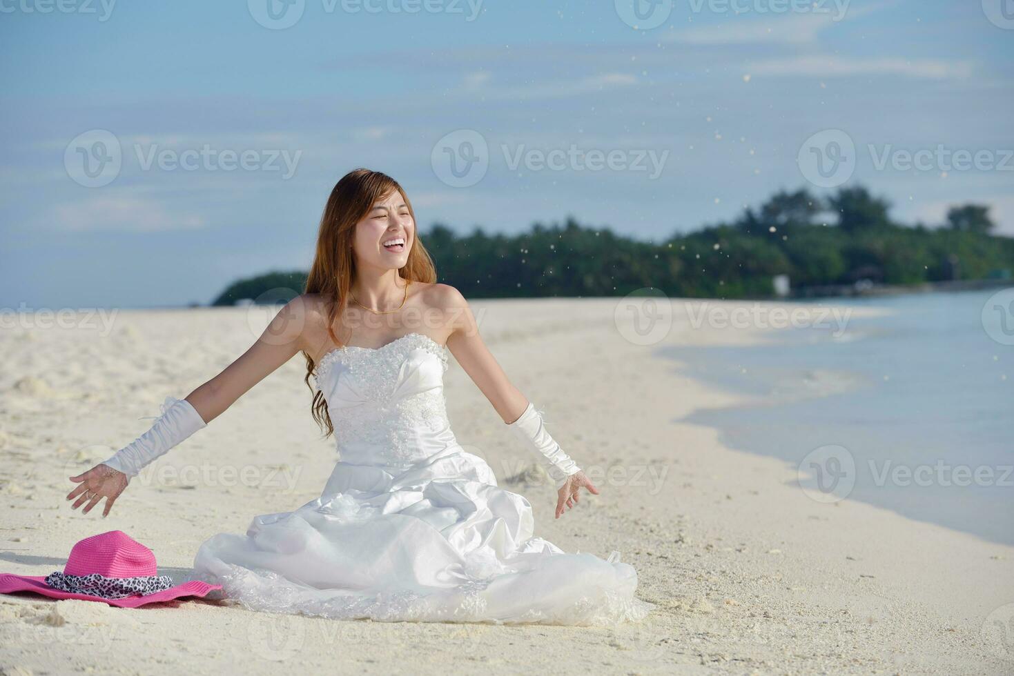 asian bride on beach photo