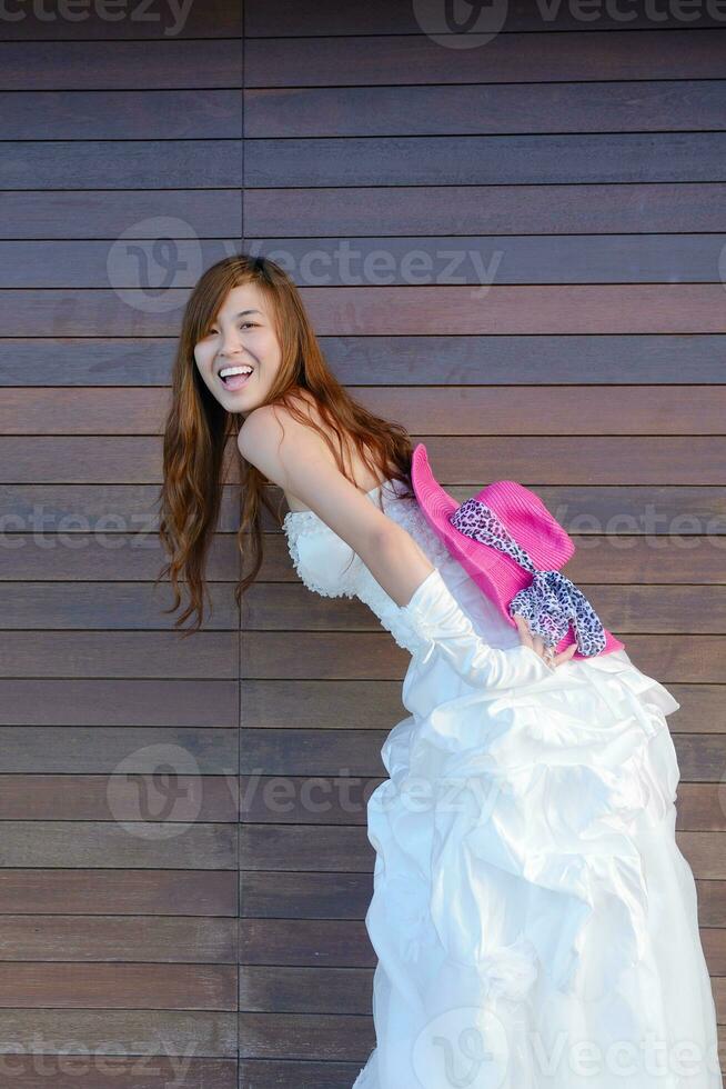 asian bride on beach photo
