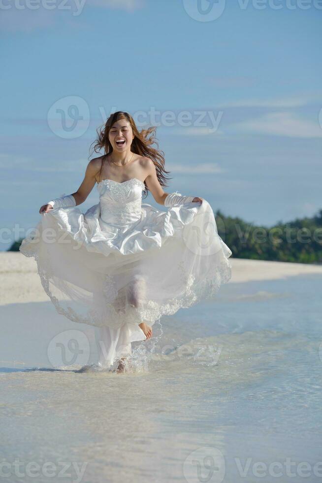 asian bride on beach photo