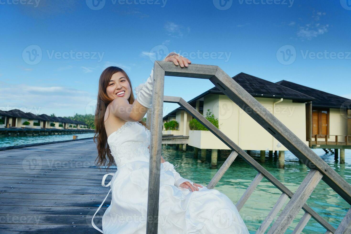 asian bride on beach photo
