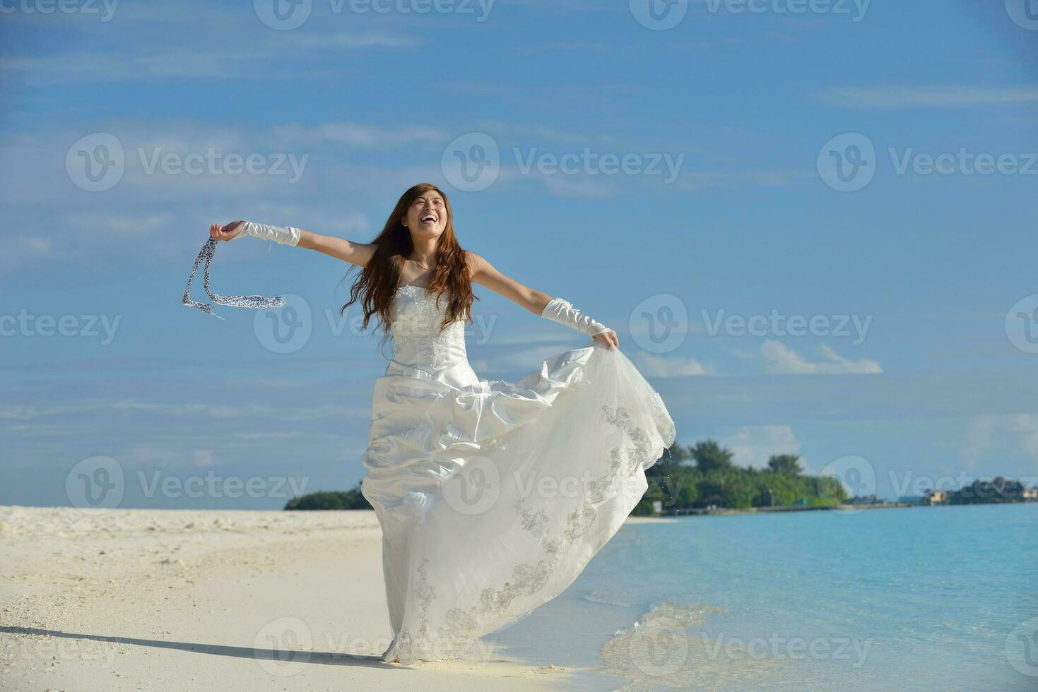 asian bride on beach photo