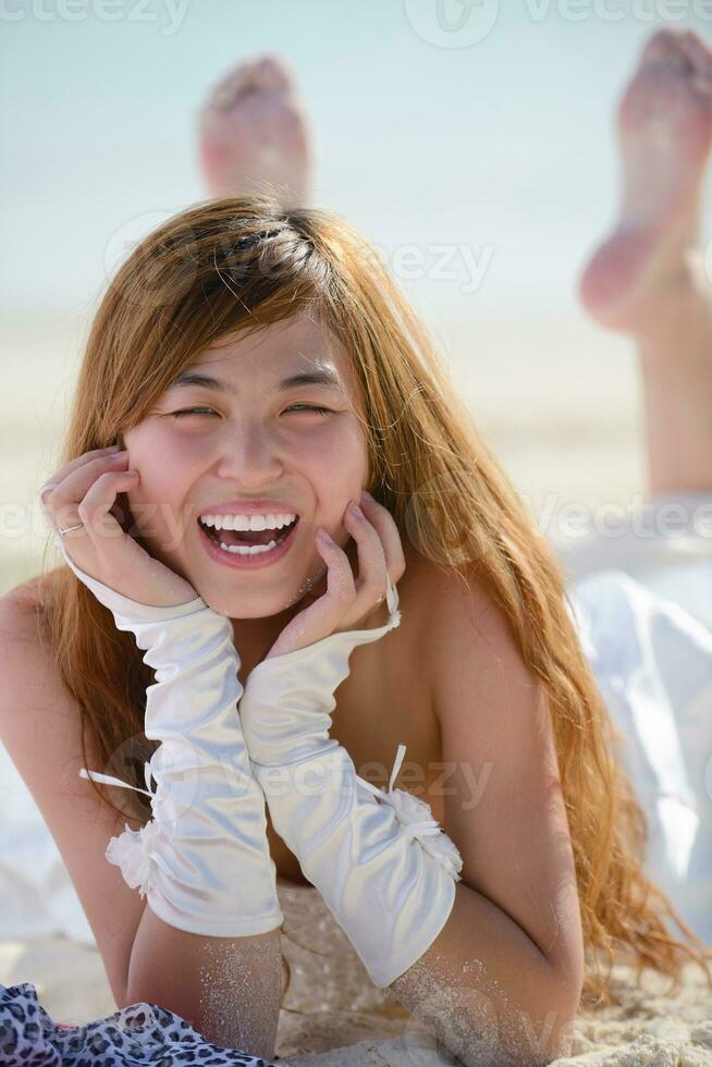 asian bride on beach photo