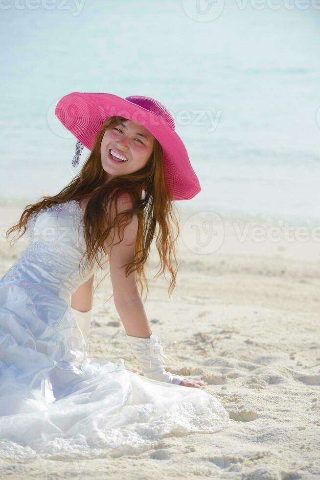 asian bride on beach photo