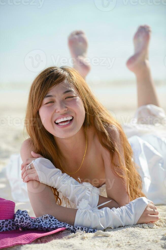 asian bride on beach photo