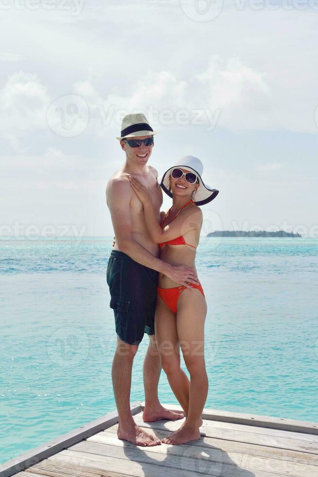 happy young couple have fun on beach photo