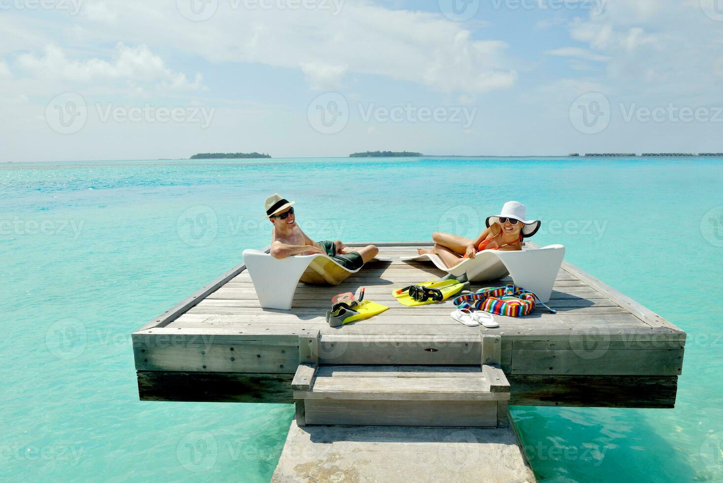 happy young couple have fun on beach photo