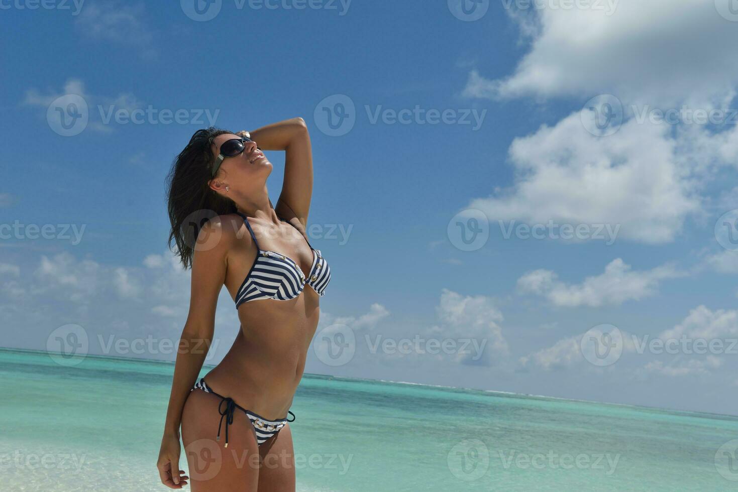 beautiful young woman  on beach have fun and relax photo