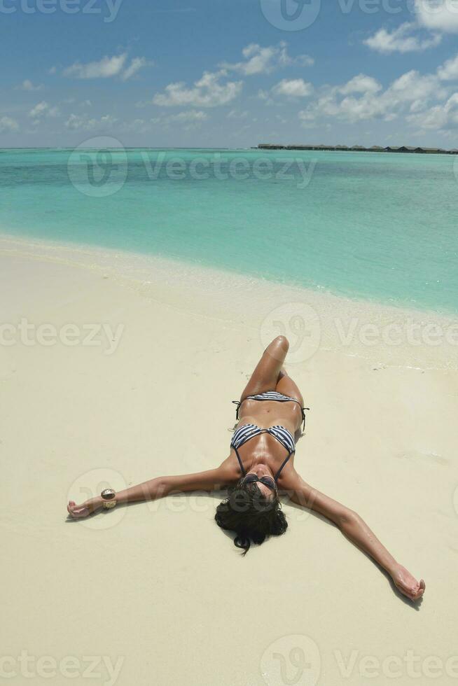 beautiful young woman  on beach have fun and relax photo