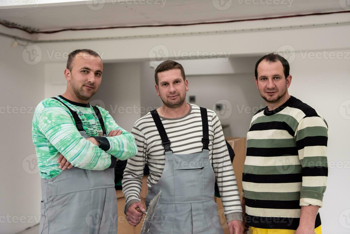portrait of Workers and builders in apartment photo