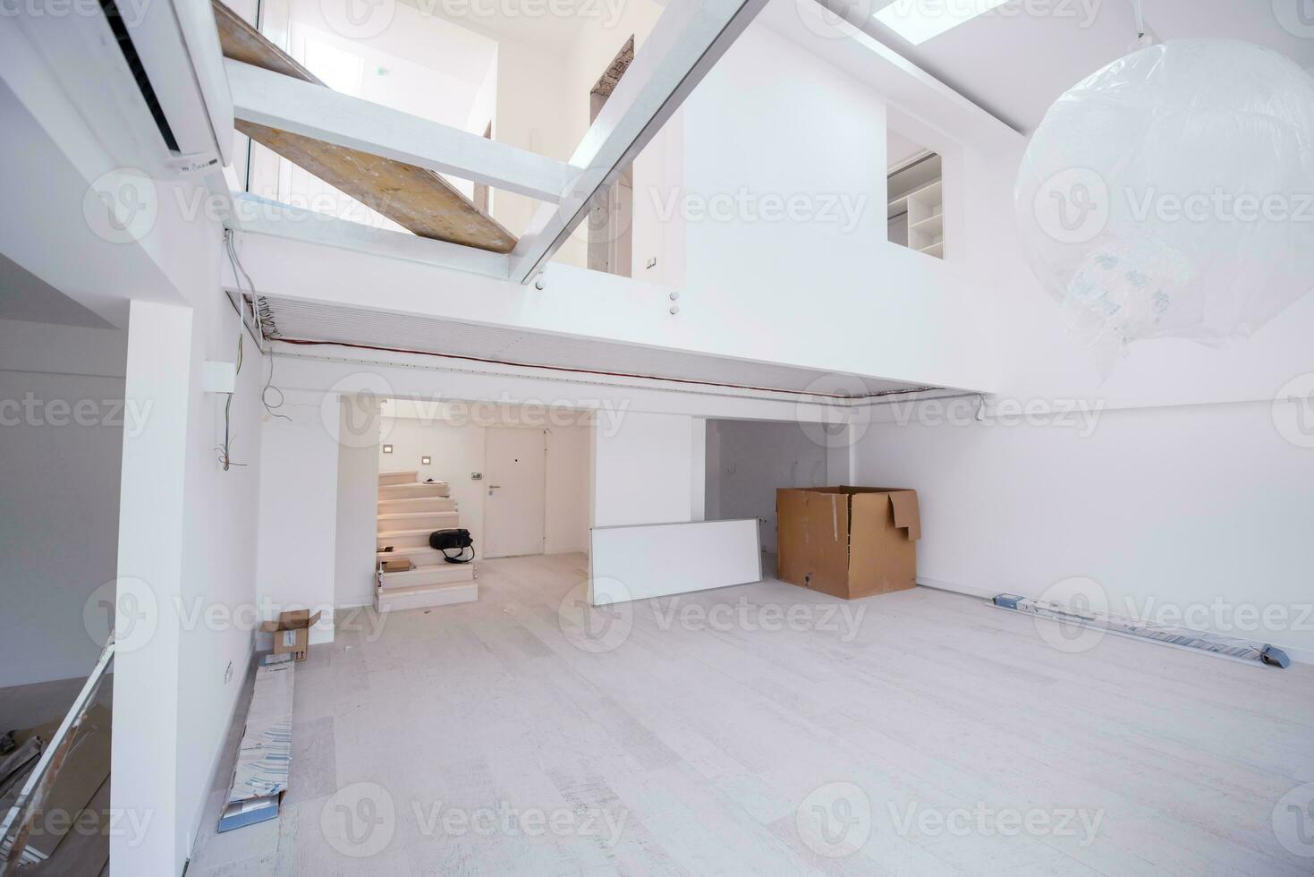 Interior of empty stylish modern open space two level apartment photo