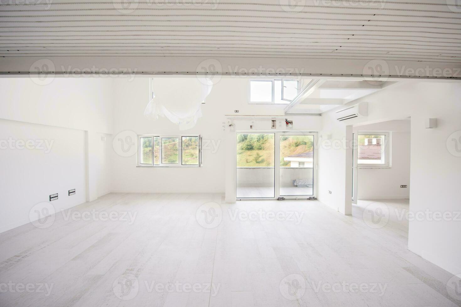 Interior of empty stylish modern open space two level apartment photo