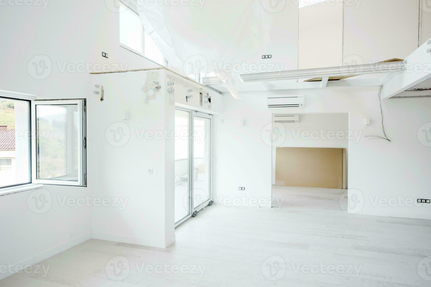 Interior of empty stylish modern open space two level apartment photo