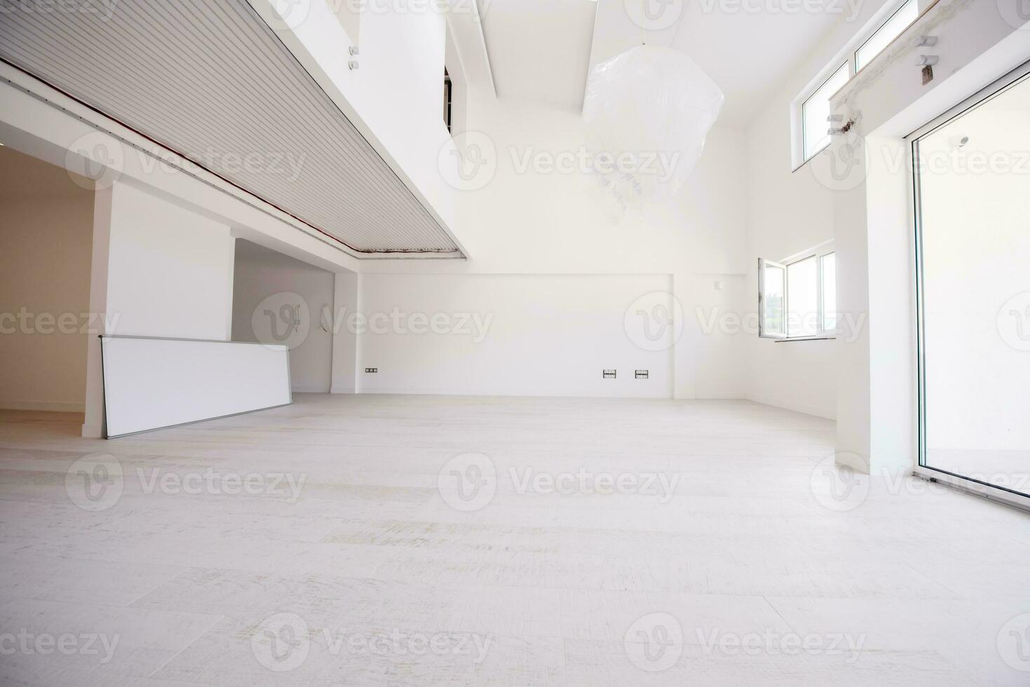 Interior of empty stylish modern open space two level apartment photo