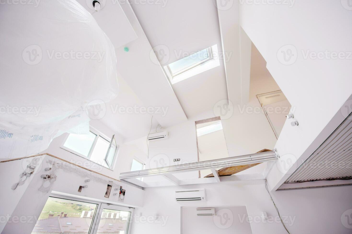 Interior of empty stylish modern open space two level apartment photo